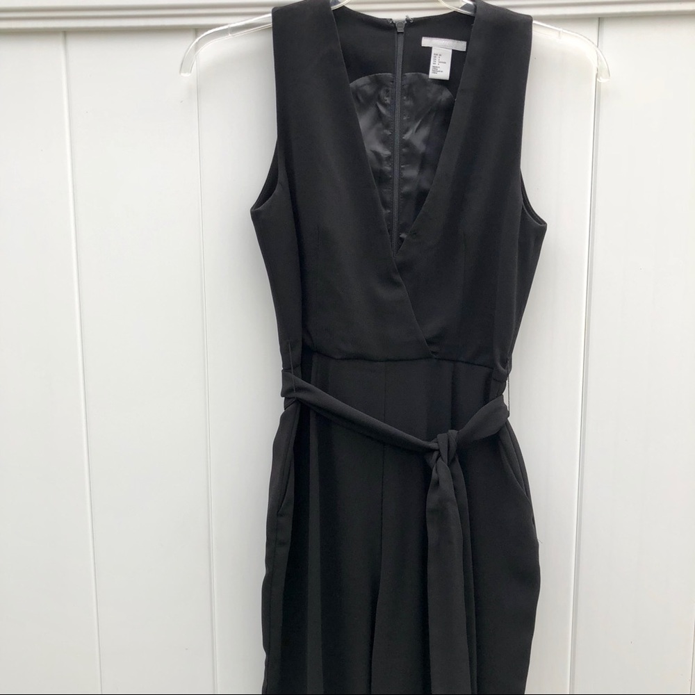 Black low cut jumper with tie at waist
